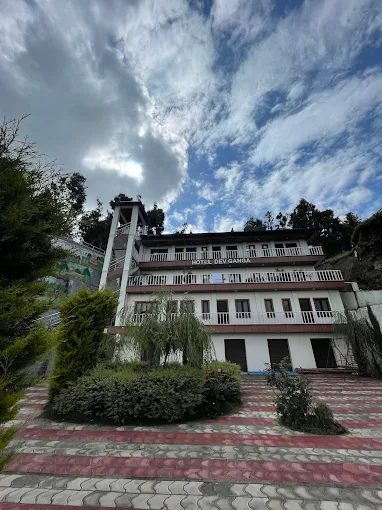 Hotel Dev Ganga building exterior in Uttarakhand mountains