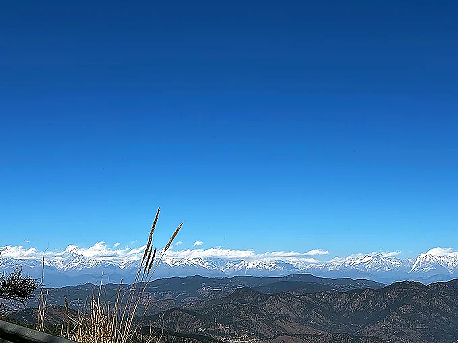 snow capped Himalayan peaks clear blue sky Almora Nainital area