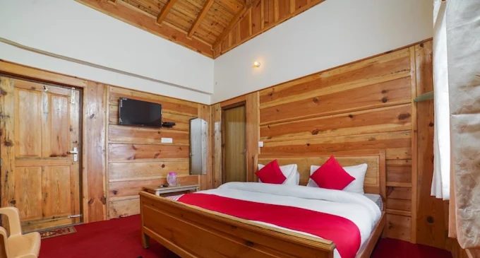 clean pahadi style hotel bathroom with wooden ceiling Uttarakhand